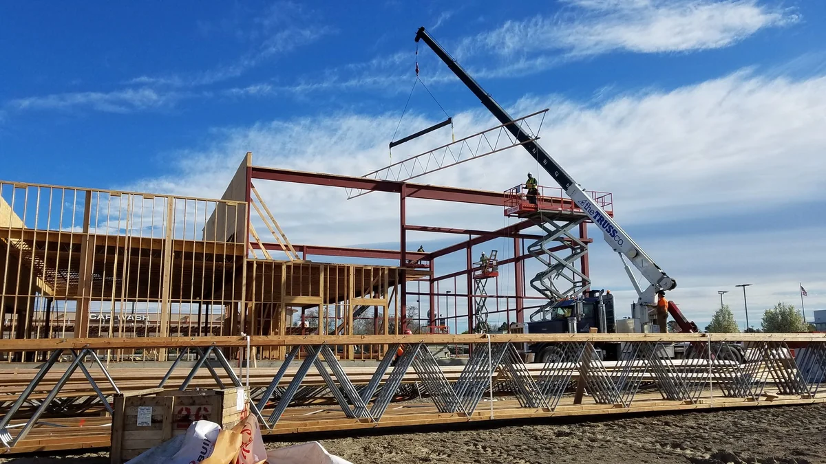 Rear corner view of The Auto Lot dealership facility